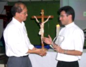 Bro. Pete gives Msgr. Christophe plaque of appreciation