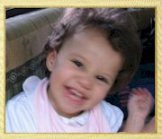 Guess who's this cute girl smiling?  She�s LINDIZ PARAS SANJURJO, 2-year old daughter of Paul Sanjurjo and former Genesis member Pia Paras. Now based in New Jersey, USA, the Sanjurjo family had their Christmas holidays in the Philippines in December 2003.