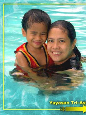 MOTHER & CHILD COVER PHOTO: Olive and MJ Cabauatan posing for a personal family shoot while a beach holiday. Olive is the mother of two boys � CJ and MJ � with loving husband, Percy. (photo taken by Bro. Percy)